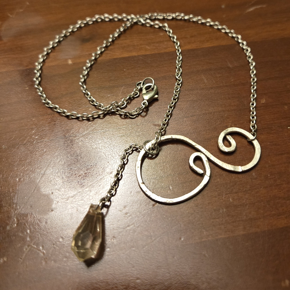 Delicate Silver-Tone Swirl Pendant Necklace with Faceted Teardrop